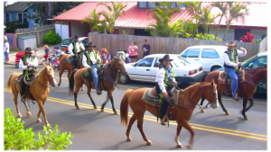 Paniolo (Hawaiian Cowboys) riding on their lio (Horse).