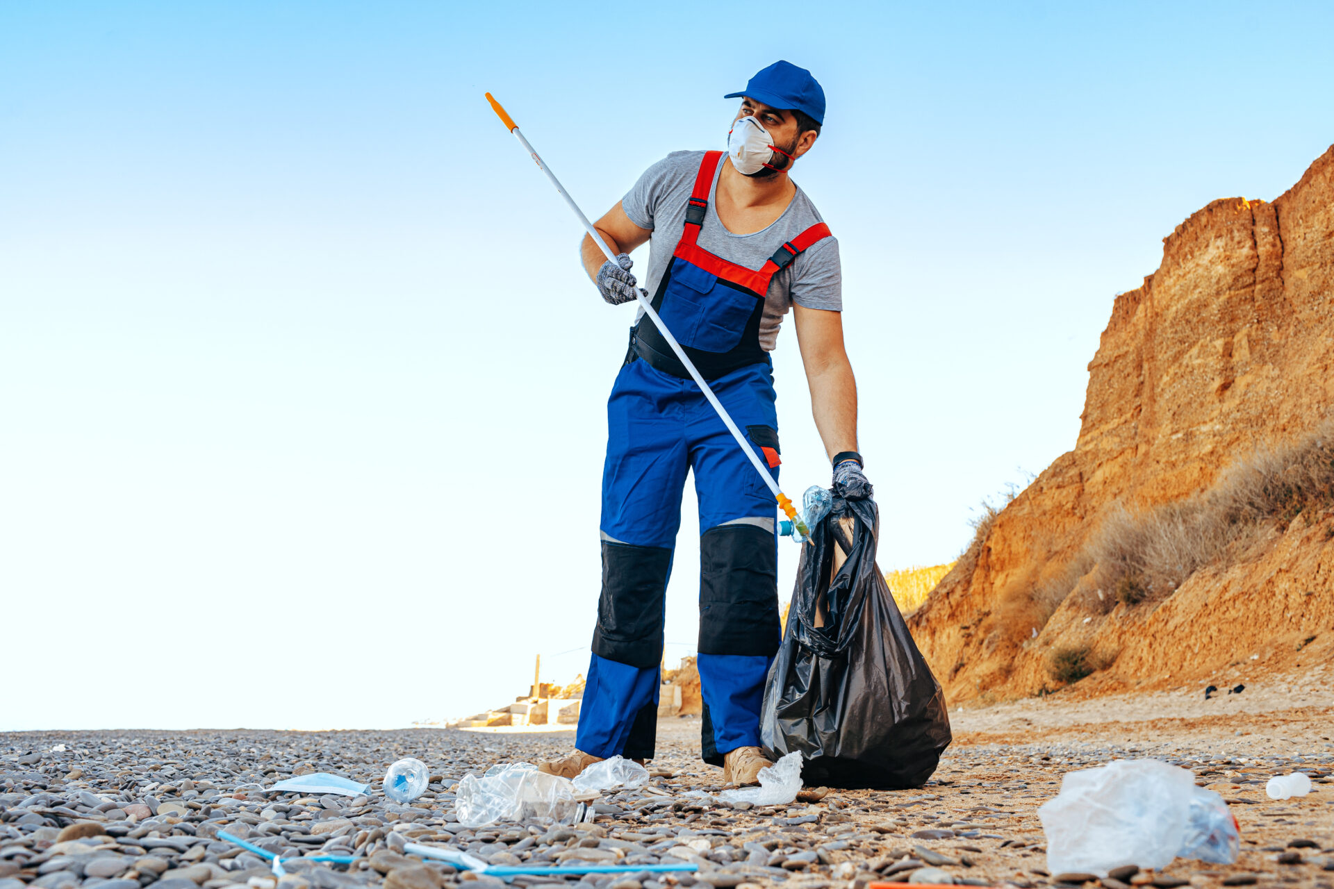 Collecting garbage on the beach