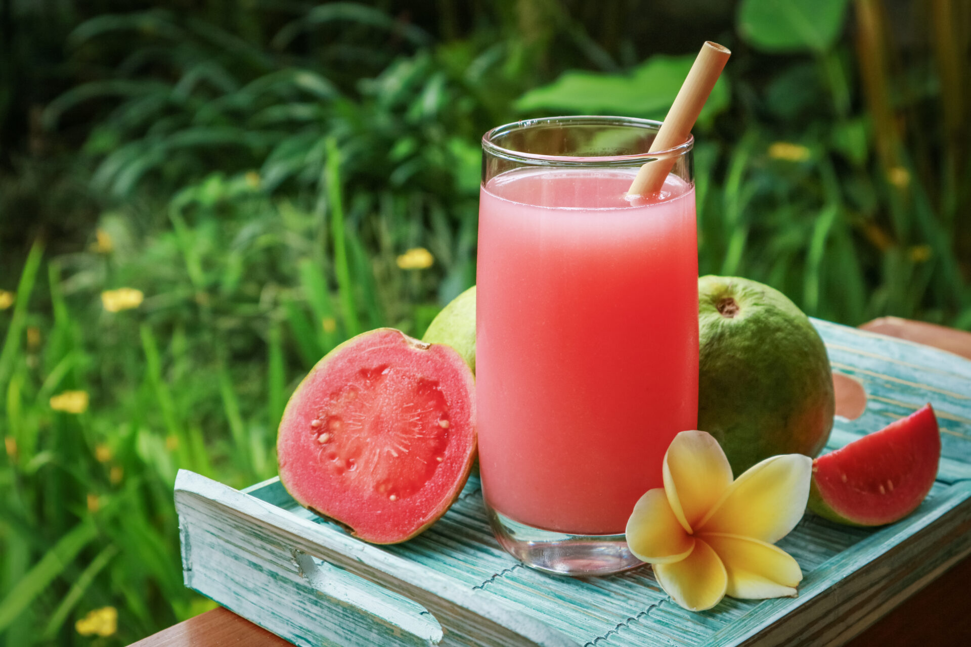 Guava juice with a yellow plumeria